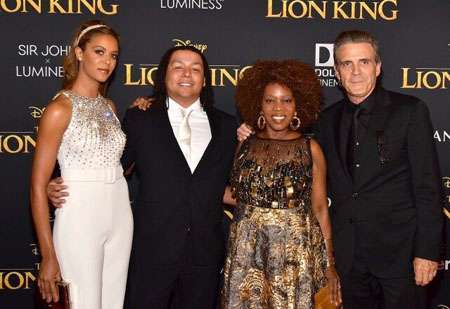 Alfre Woodard with her husband and two children during the red carpet event of The Lion King.