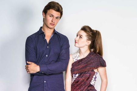 Ansel Elgort and Kaitlyn Dever taking a picture together.