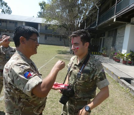benjamin getting tika on his forehead after becoming a Gurkha officer.