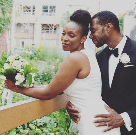 Lisa Berry and her husband Dion Johnstone during their marriage ceremony.