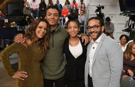 Sunny Hostin and Emmanuel Hostin with their kids in an adorable family picture.