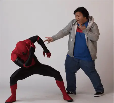 Spider-Man and Ned Leeds goofing on a photo shoot.