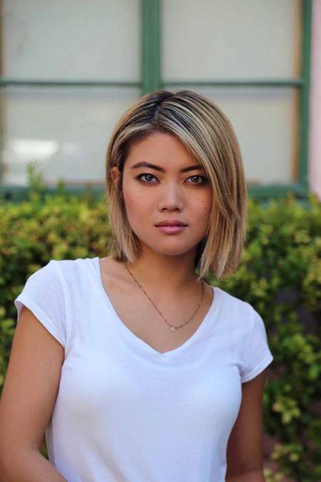 Jessica Lu with a short trimmed hair and white t-shirt.