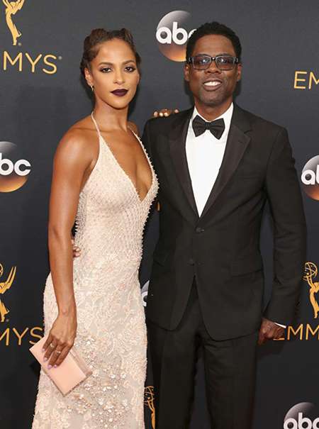 Megalyn Echikunwoke and Chris Rock together at the Emmy Awards.