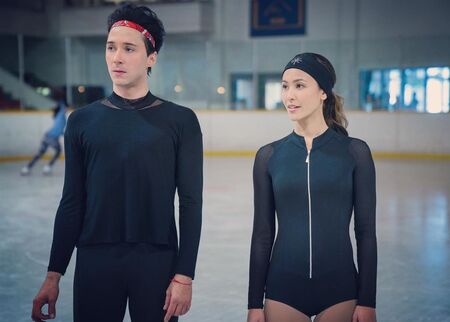 Kaitlyn Leeb and Johnny Weir as Leah Starnes and Gabriel “Gabe” Richardson, respectively, in the Netflix ice skating series Spinning Out (2020).