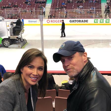 Michael Shanks and Lexa Doig watching their ice hockey team Vancouver Canucks at Rogers Arena.