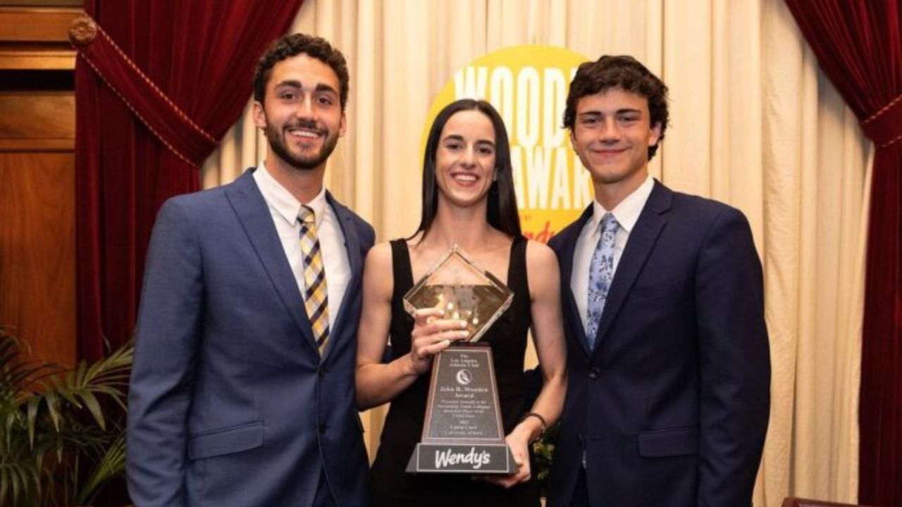Caitlin Clark posing with her brothers, Blake and Colin. celebsindepth.com