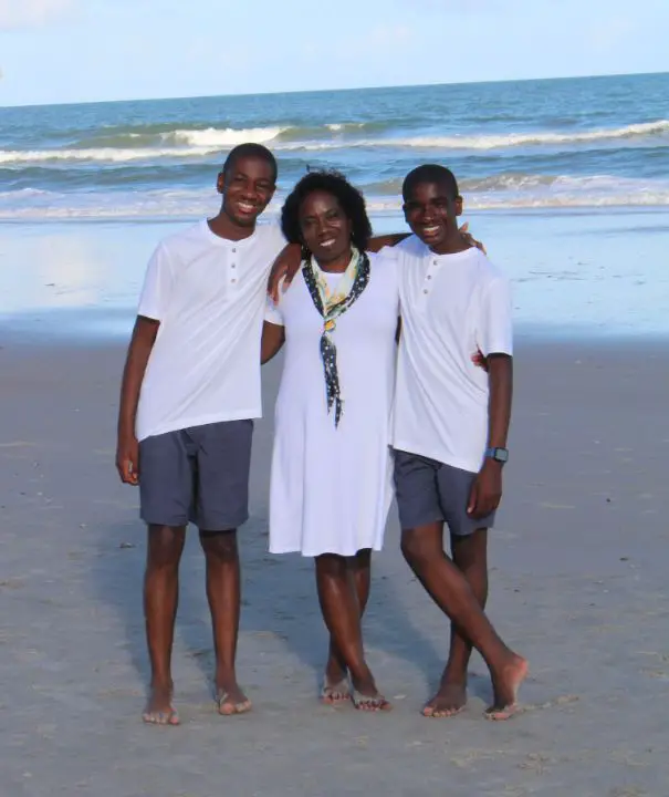 Gwen Keyes Fleming with her son Kyle and Corey on the beach. celebsindepth.com
