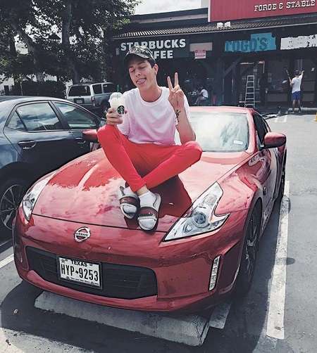 Tayler Holder on his Nissan car.