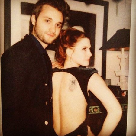 Alexandra Breckenridge back tattoo is something of a north symbol.