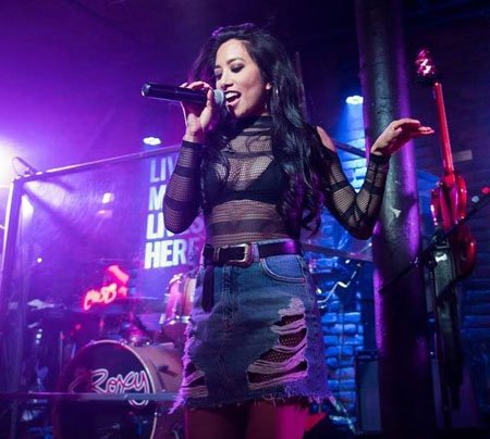 Donna Benedicto started singing in a cover band continuing her career as a singer.