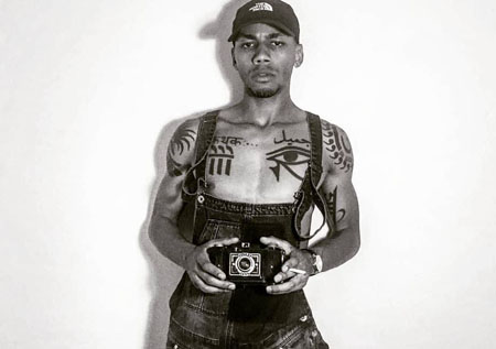 Jahmil French is inked with Urdu markings and Sanskrit markings on his upper body.