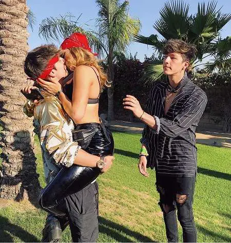 Tayler Watching his friends, Bryce Hall and Elle Danjean kiss on the side