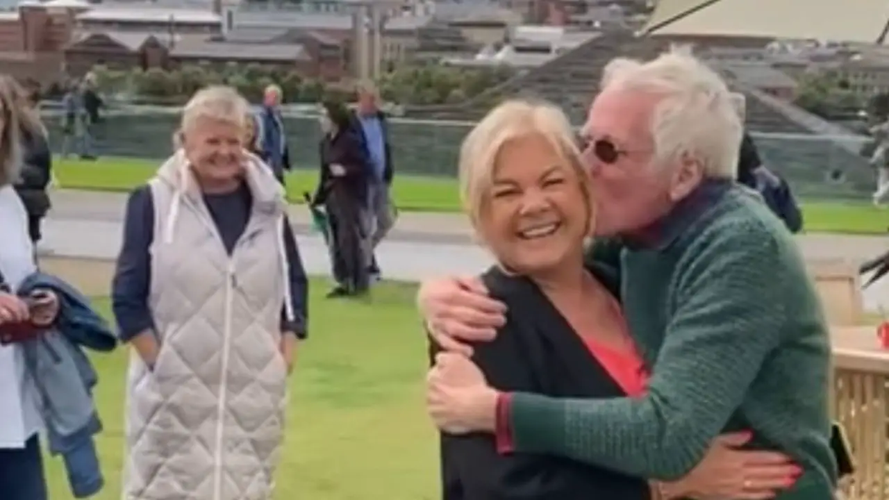Andy McConnell was kissing a lady during Antiques Roadshow recording. celebsindepth.com