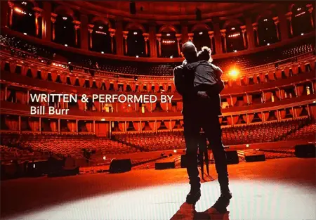 Bill Burr with his daughter on the stage inside the Royal Albert Theatre.