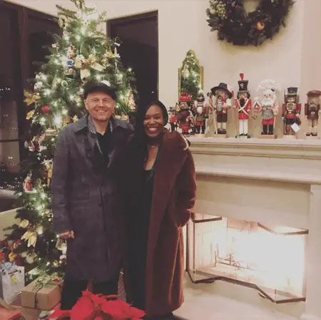 Christmas tress and Bill and Nia standing in front of it.