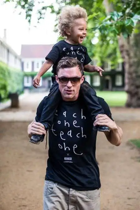 Ed Skrein with his son Marley Skrein sitting on his shoulder.