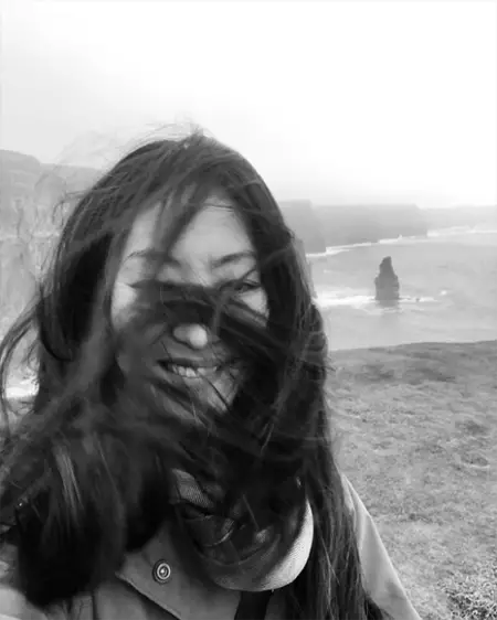 Elizabeth Anweis with her hair covering her face due to the wind.