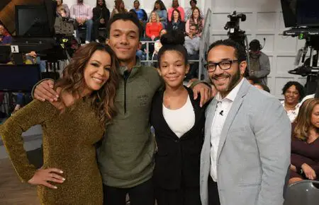Sunny Hostin and Emmanuel Hostin with their kids in an adorable family picture.