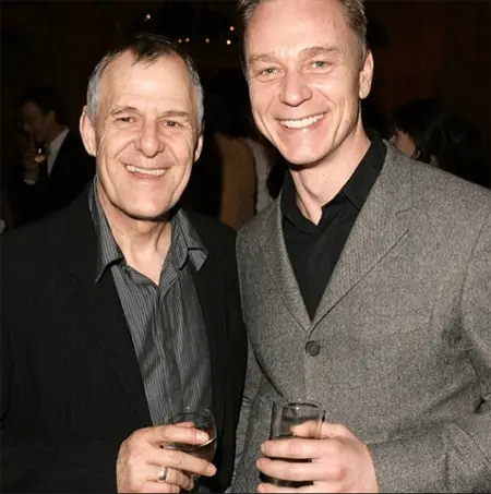 Ian Gelder and Ben Daniels are sharing a drink.
