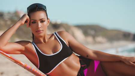 Ilfenesh in her beach wear, posing for a photo, she appeared in Baywatch.