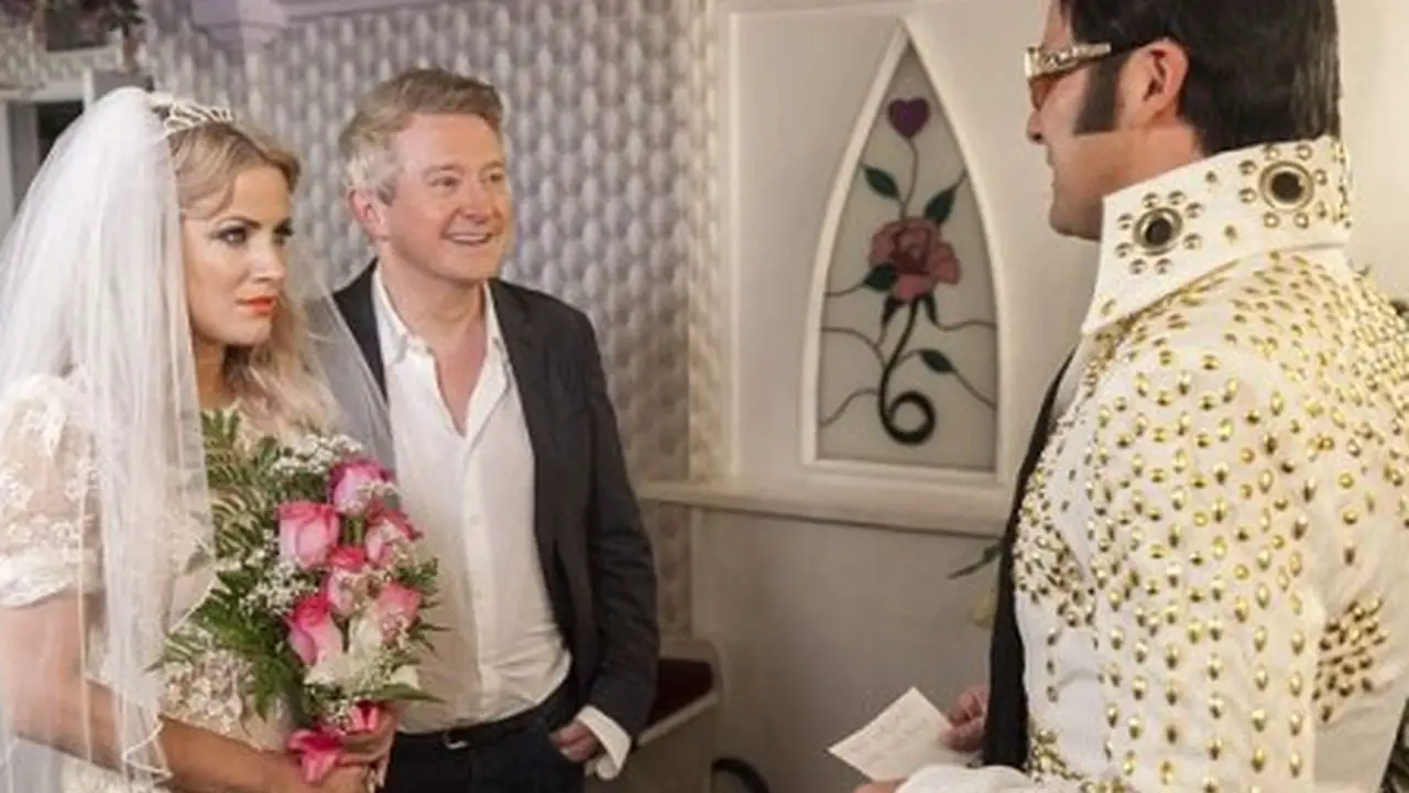 Louis Walsh with Caroline Flack. celebsindepth.com