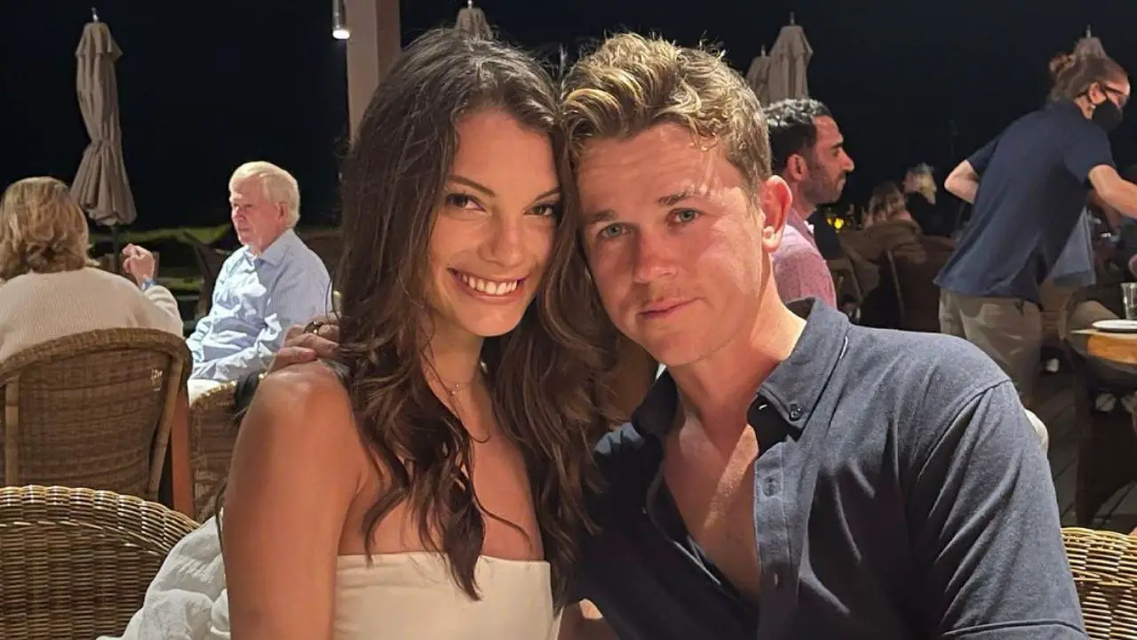John and Olivia taking a picture while going they're on a date.