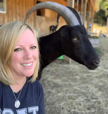 Leanne Lauricella and goat Ansel in a photo together.