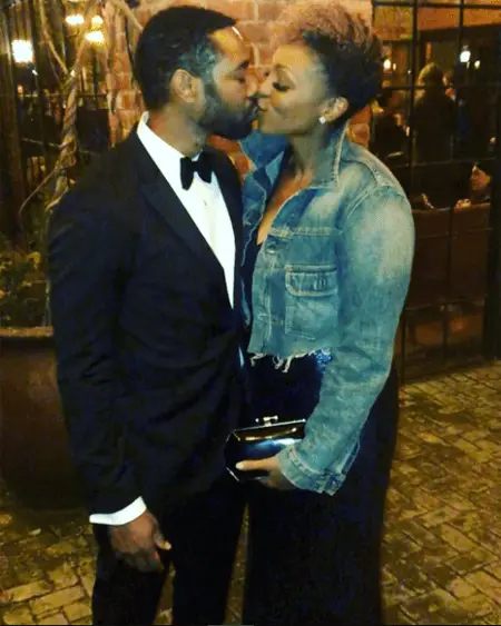 Lisa and Dion kissing before a party.
