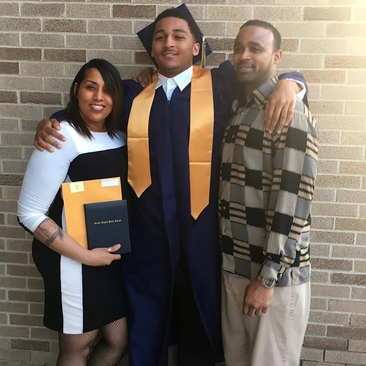 Marshawn Kneeland with his parents.