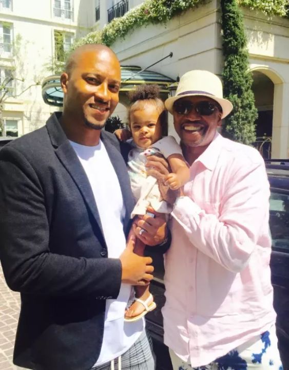 TK Carter with his son and granddaughter.