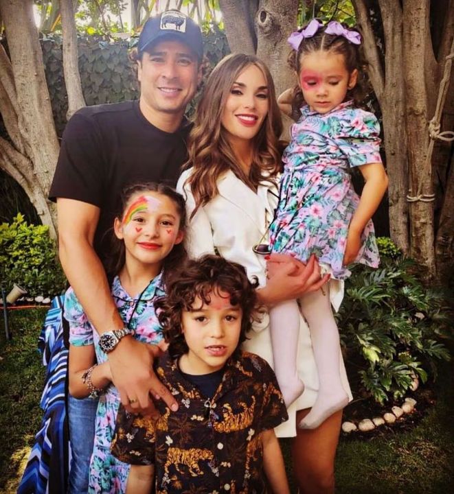 Memo Ochoa with his wife and kids.
