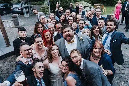 Every relative present during the wedding shouting 'Yeah!' at the camera, including Jorge Garcia and his wife, Rebecca Birdsall.