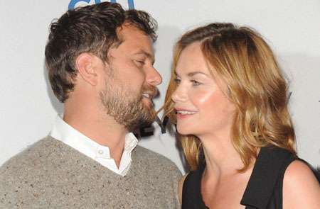 Ruth Wilson and Joshua Jackson standing really close to one another.