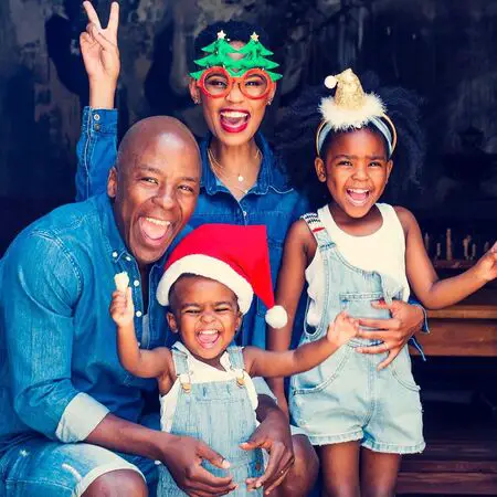 Gail Mabalane with her husband Kabelo Mabalane and their two kids.