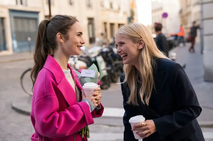 A scene from 'Emily in Paris', Lily Cooper (left) and Camille Razat's (right) characters during a conversation.
