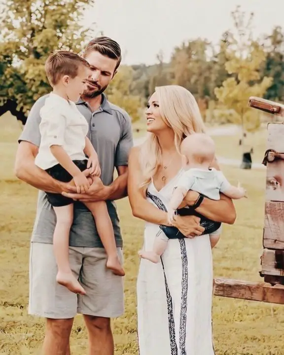 Carrie Underwood with her husband and two children. celebsindepth.com
