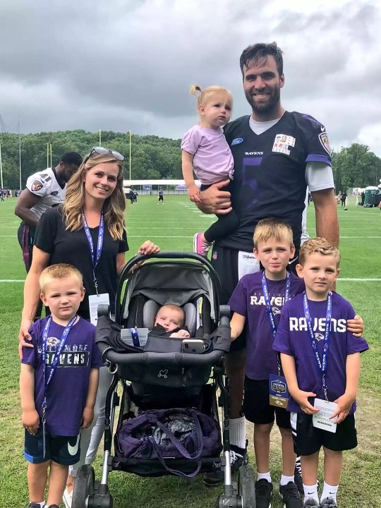 Joe Flacco with his wife and kids.