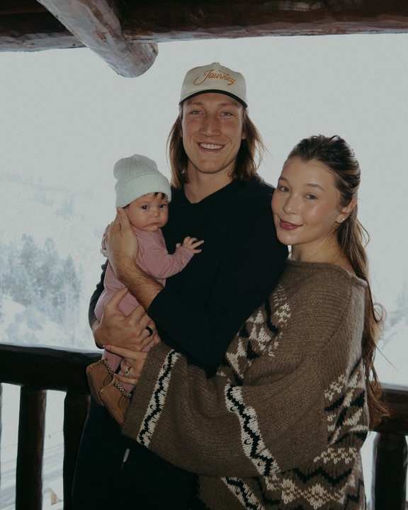 Trevor Lawrence with his wife and daughter.